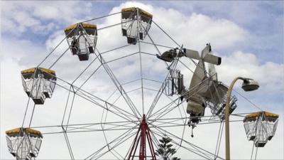 Light aircraft stuck in ferris wheel