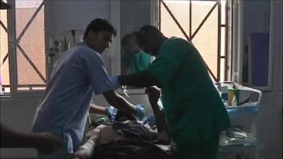 Libyan doctors working on patient in hospital