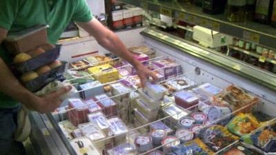 Shop's freezer unit full of food