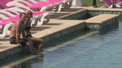 Couple by pool in Lebanese resort