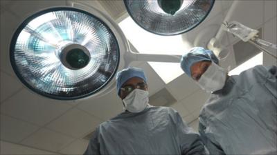 Surgeons in an operating theatre