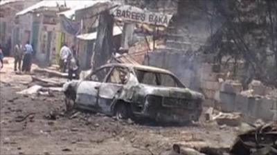 Shell of a car burnt out by the blast