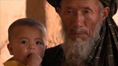 Afghan man with child