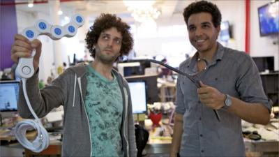 Quirky.com workers holding inventions