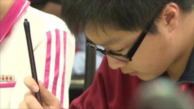 Child practices calligraphy