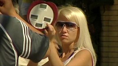 Sochi holidaymaker looking in mirror