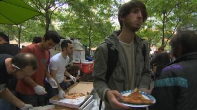 Protester eating pizza in New York