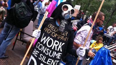 A protestor where a mask at the Occupy Wall Street demonstration