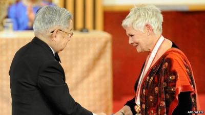 Dame Judi Dench receives her award from Prince Hitachi