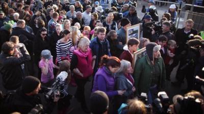 Travellers and protesters staged a mass walkout