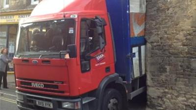 Lorry wedged stuck in street