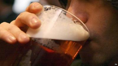 Man drinking a pint