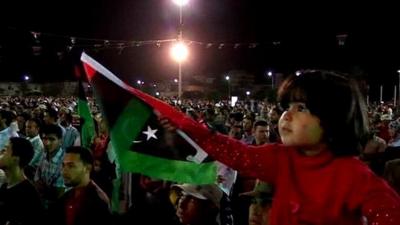 Girl waving Libyan flag