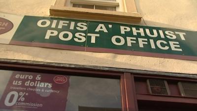 Post office sign in Gaelic and English