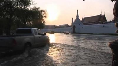 Car driving through flood water