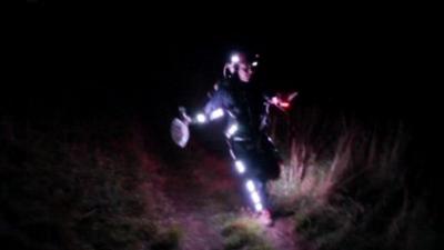 Runner wearing a suit covered in lights