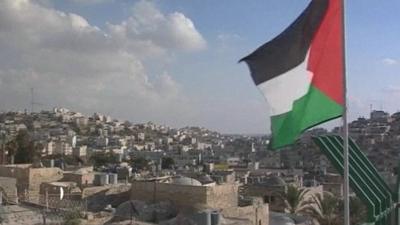 Palestinian flag flies over the Old City of Hebron, West Bank