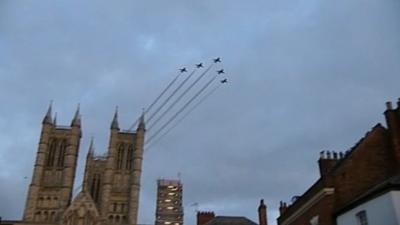 Five Red Arrows in formation above Lincoln cathedral