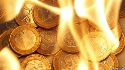 Euro coins on fire