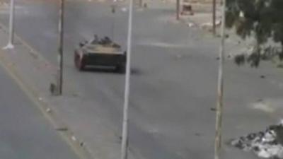 Tank in empty street in Homs