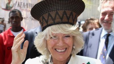 Camilla tries on hat