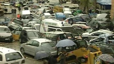 Cars crushed together after the flood