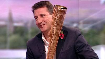 Lord Coe with 2012 Olympic torch