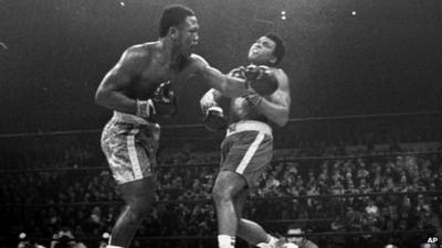 Joe Frazier hits Muhammad Ali with a left during the 15th round of their heavyweight title fight