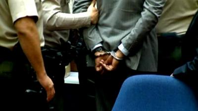 Dr Conrad Murray in handcuffs