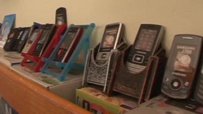 Mobile phones on display in a shop in Mumbai