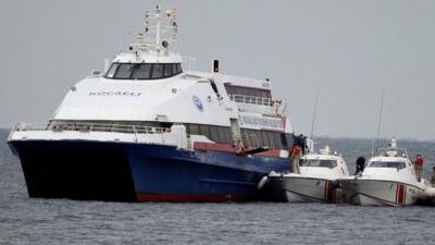 Passengers disembark from the ferry