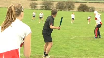 The BBC's Mike Bushell playing rounders in Dinnington