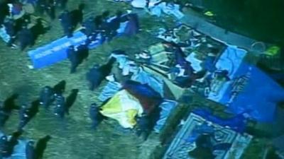 Police at the camp at Oakland's Frank Ogawa Plaza