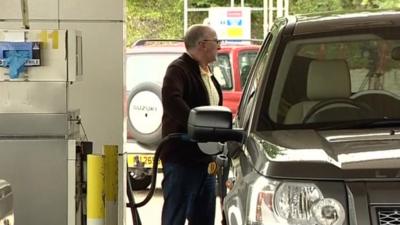 Motorist at petrol station