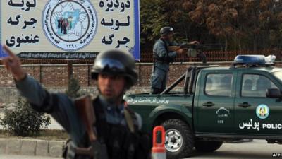 Afghan policemen stand guard in Kabul