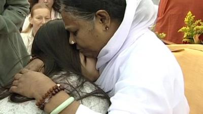 Amma hugging a woman