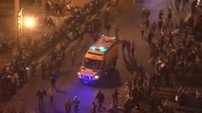 An ambulance arrives in Tahrir Square