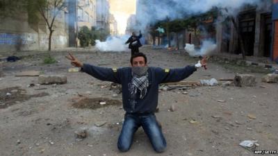 An Egyptian protester shows the V-sign for victory