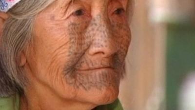 An old tattooed woman from Derung