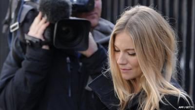 Actress Sienna Miller (R) leaves after giving evidence at the Leveson Inquiry