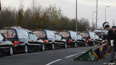 Hearses pass veterans