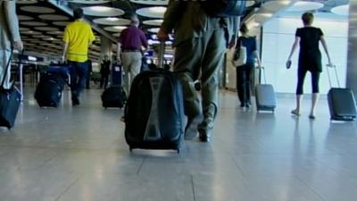 Travellers with suitcases