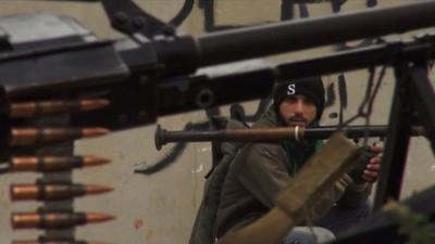 Member of the Free Syrian Army with artillery.