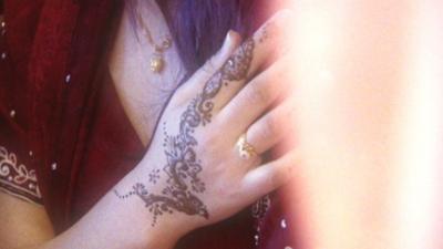 Woman with henna on her hand