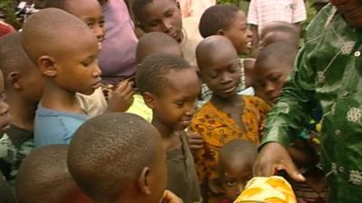 One of the candidates meeting children