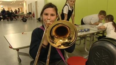 Girl playing the trombone