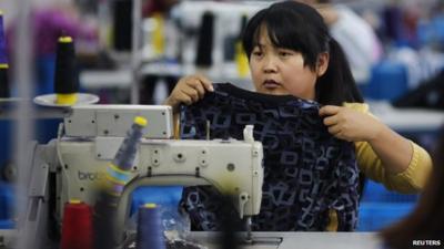 An employee works at a textile factory in Yiwu, Zhejiang province, China