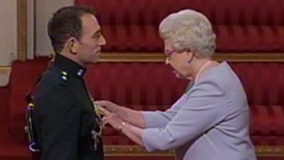 Lt Paul McFarland receives the Military Cross from the Queen