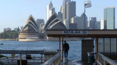 A view of the Sydney Opera House from a ferry terminal in the harbour.