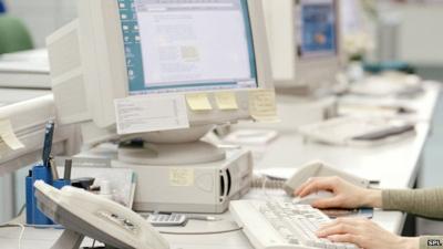 woman using computer at work